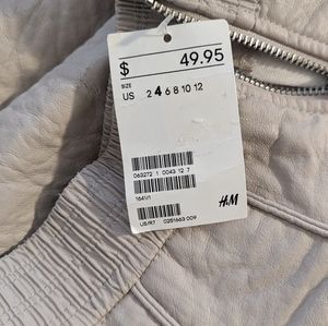 Women's leather like mini skirt side zip up